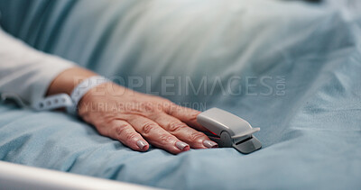 Buy stock photo Hand, person and pulse oximeter on hospital bed to measure blood levels, monitor and recovery. Closeup, senior patient and resting with medical machine, track oxygen and critical care from operation