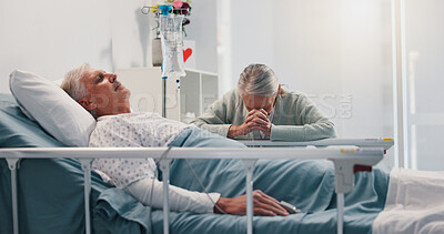Buy stock photo Senior woman, man and praying by hospital bed for faith, love or hope for healing in retirement. Elderly people, couple and religion for wellness, visit and sick patient for rehabilitation at clinic