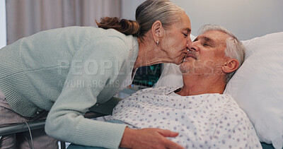 Buy stock photo Senior woman, man and kiss in hospital bed for care, love or support for healing in retirement. Elderly people, couple and kindness with illness, sick and visit patient for rehabilitation at clinic