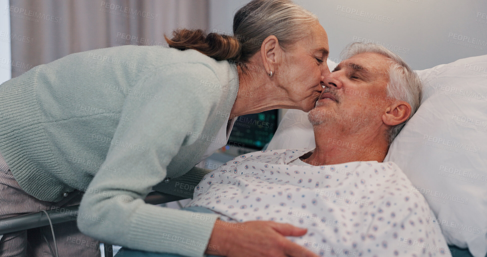 Buy stock photo Senior woman, man and kiss in hospital bed for care, love or support for healing in retirement. Elderly people, couple and kindness with illness, sick and visit patient for rehabilitation at clinic