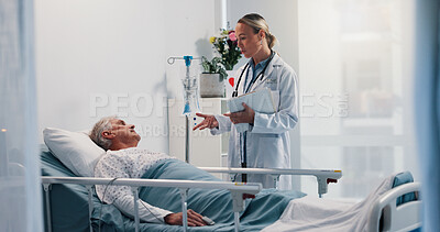 Buy stock photo Doctor, consulting and senior man in hospital bed for healthcare, diagnosis or test results. Conversation, medical records or update with medicine professional and patient in clinic for recovery