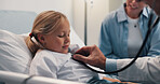Doctor, child or stethoscope on hospital bed for checkup, visit or examination at healthcare clinic. Girl, kid and medical professional checking patient with tool for heart beat, cardiology or test