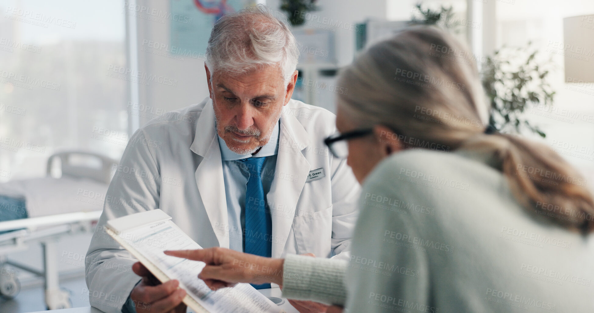 Buy stock photo Doctor, man and woman with document for medical aid, life insurance or application in clinic. People, healthcare employee and clipboard with form, survey or paperwork for registration or service