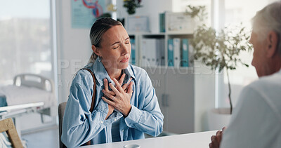 Buy stock photo Hospital, doctor and patient with chest pain, talking or medical appointment for help or healthcare. Checkup, specialist and listening to symptoms of angina, consultation and woman with pressure