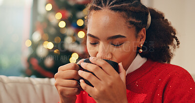 Buy stock photo African woman, drink and coffee on Christmas for holiday tradition, comfort and celebrate festive. Female person, relax and beverage, enjoy eggnog and seasonal break with nostalgia memory at house