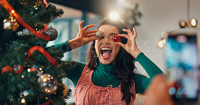 Buy stock photo Christmas tree, funny and picture with woman and ornament for festive season, memory and decoration. Merry xmas, holiday and photography with silly person in living room of home for happy and bauble