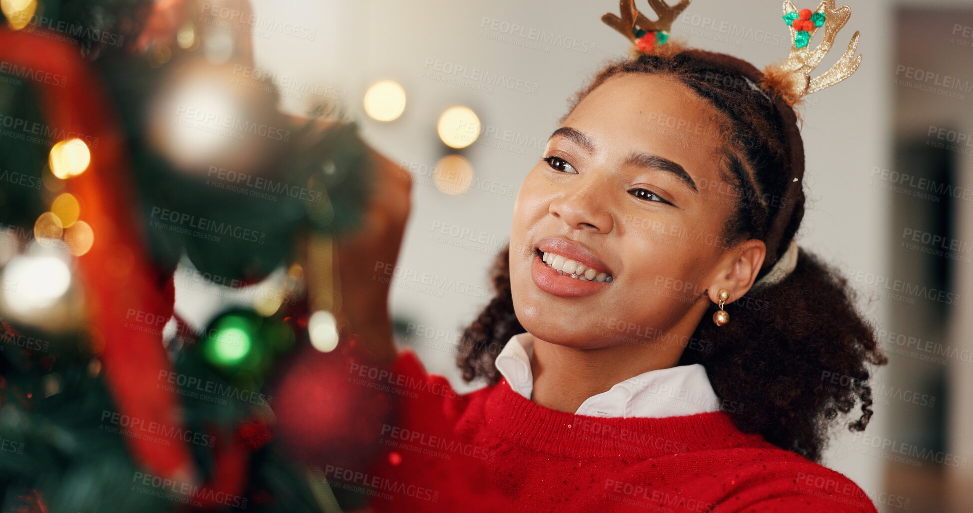 Buy stock photo Christmas tree, happy and woman in home with decorations for festive celebration, event or party. Smile, holiday season and female person preparing for xmas with hanging ornaments in apartment.