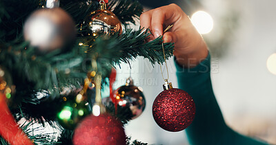 Buy stock photo Person, hand and christmas tree with bauble for decor, festive event or december holiday in home. Closeup, ornament or hanging sparkle ball for new year celebration or Santa decorations at house
