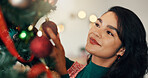 Happy woman, christmas tree and bauble with decor for festive event or december holiday in home. Female person, ornament or sparkle with decorations for new year celebration or gift of Santa at house