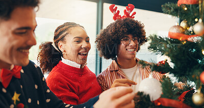 Buy stock photo Christmas tree, decoration and teamwork with friends in home living room for social celebration. December, gathering and ornament with group of happy people in apartment together for holiday season