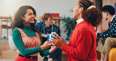 Buy stock photo Christmas, present and box with friends at party for celebration, festive holiday and reunion. Gift giving, support and merry xmas season with people in living room of home for love and social