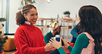 Christmas, present and love with friends at party for celebration, festive holiday and reunion. Gift giving, support and merry xmas season with people in living room of home for box and social