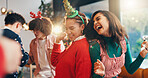 Christmas, dance and party with friends in home for celebration, festive season and laugh. Bonding, xmas holiday and reunion with group of people in living room for entertainment and social event