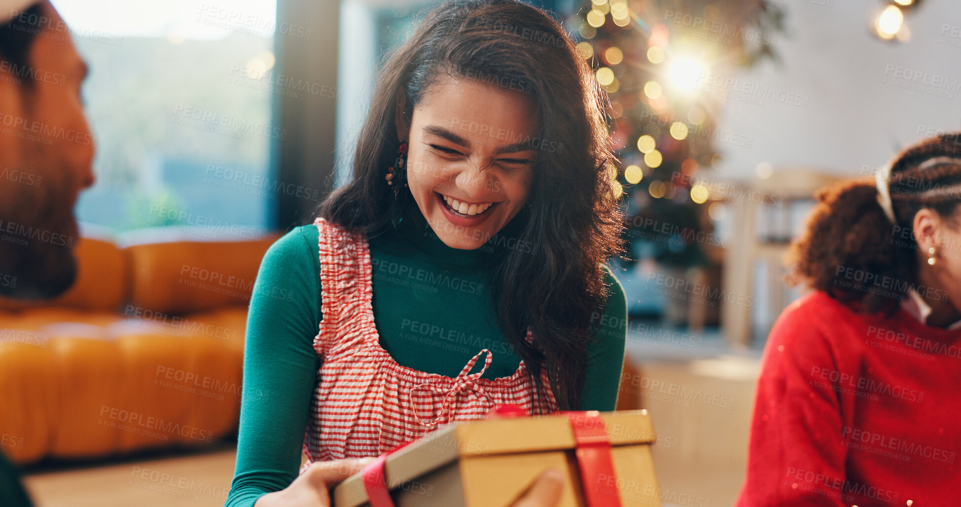 Buy stock photo Happy, gift giving and friends in home for christmas event, party or celebration together. Excited, woman and people with presents for secret santa tradition on xmas eve for festive holiday in house.