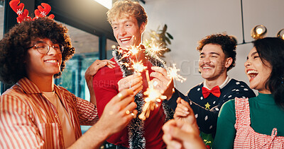 Buy stock photo Happy people, christmas and celebration with fireworks for new year or festive season in home. Excited, group or friends with smile or sparklers in joy for party, event or december holiday at house