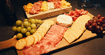 Buy stock photo Snack board, ingredients and food for celebration, grapes and crackers for festive season and party. Meat, meal and platter for gourmet, fruit and menu with nutrition for thanksgiving or charcuterie