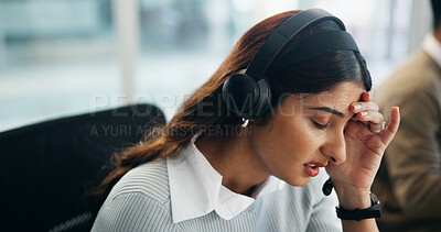 Buy stock photo Headache, stress and call center with business woman in office for crisis hotline, depression or contact us. Fatigue, mental health helpline and emergency support with person in agency for consultant