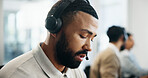 Think, serious and man in call center for technical support, IT insight or coworking. Headset, problem solving or operator in profile for virtual troubleshooting, software query or customer complaint