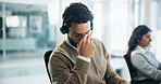 Headache, tired and call center with business man in office for crisis hotline, depression or contact us. Fatigue, mental health helpline and emergency support with person in agency for consultant