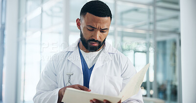 Buy stock photo Reading, medical diagnosis and man with document, doctor and serious for test result or information. Review, paperwork and person with patient records for treatment plan, healthcare and hospital