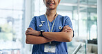 Arms crossed, nurse and woman with pride in healthcare profession for help, advice and expert at hospital. Confidence, about us and female worker for medical care, health and wellness with smile