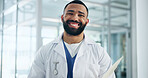 Doctor, man and happy in portrait at hospital for career, documents and services at healthcare center. Person, medical professional and smile with job for paperwork, admin and face at clinic in Cuba