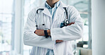 Arms crossed, doctor and pride in healthcare profession with help, advice and man at hospital. Confidence, about us and male physician for medical care, health and wellness with expert at clinic