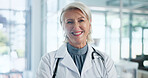 Portrait, doctor and woman in hospital, smile and career ambition with specialist. Mature person, medical service and professional in clinic, confidence and pride with healthcare and happiness