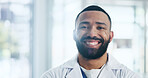 Doctor, man and portrait with smile at hospital for career, pride and services at healthcare center. Person, medical professional and happy with job for wellness, advice and face at clinic in Cuba