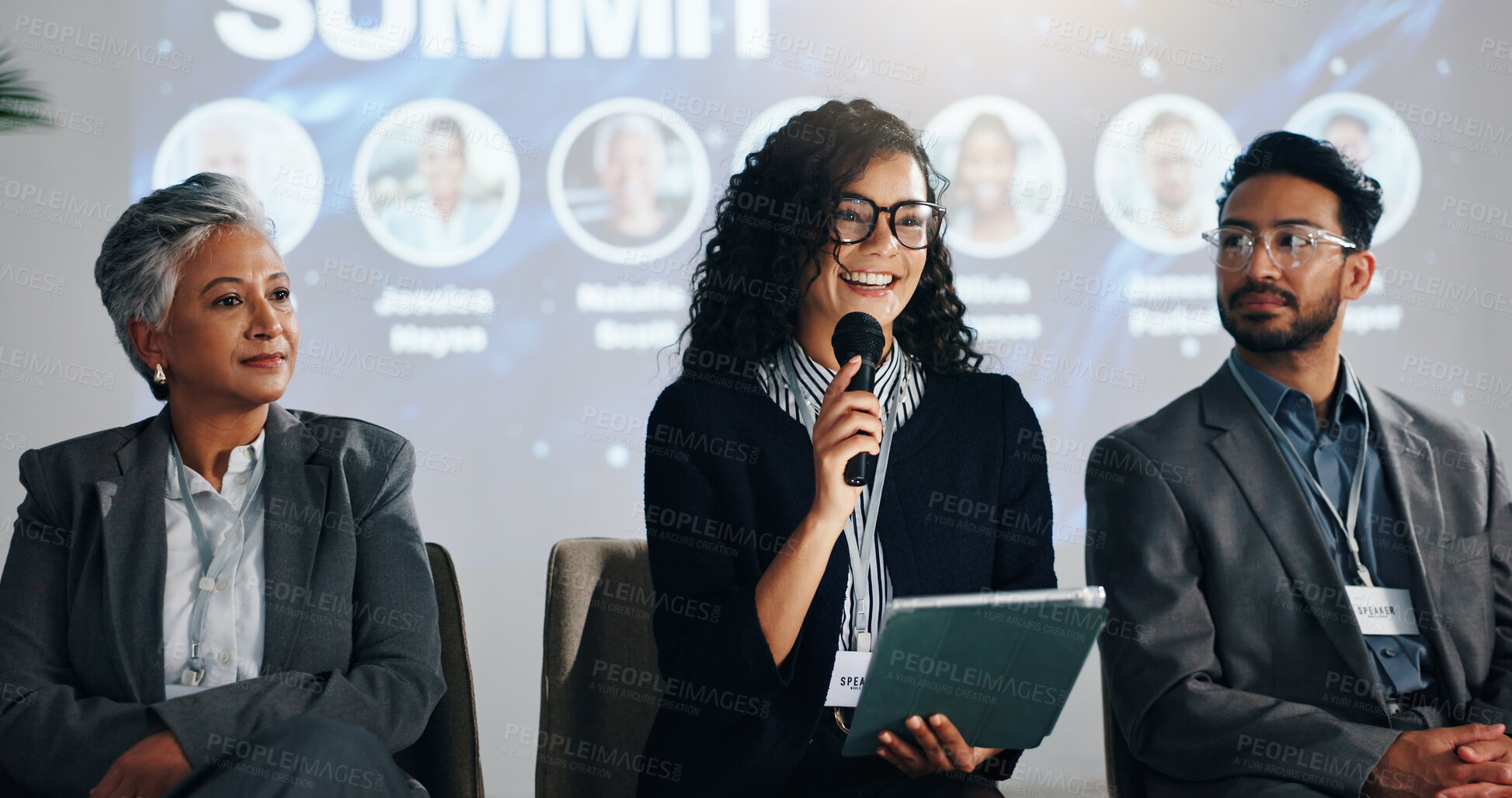 Buy stock photo Stage, public speaking and woman with mic, tablet and smile for training session, group and seminar. Presentation, happy and speaker with motivation for entrepreneurship, people and tech for speech