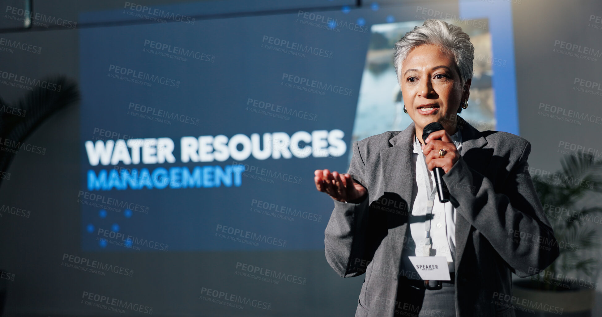 Buy stock photo Woman, speech and mic at conference event for water management with resources. Mature person, public speaking and scarcity solution, pollution awareness and sustainable supply of economic development