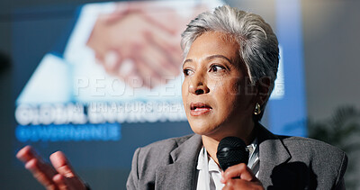 Buy stock photo Mature woman, mic and presentation for environment on stage, governance and speech at convention. Person, speaker and discussion for global sustainability, info and accountability at conference