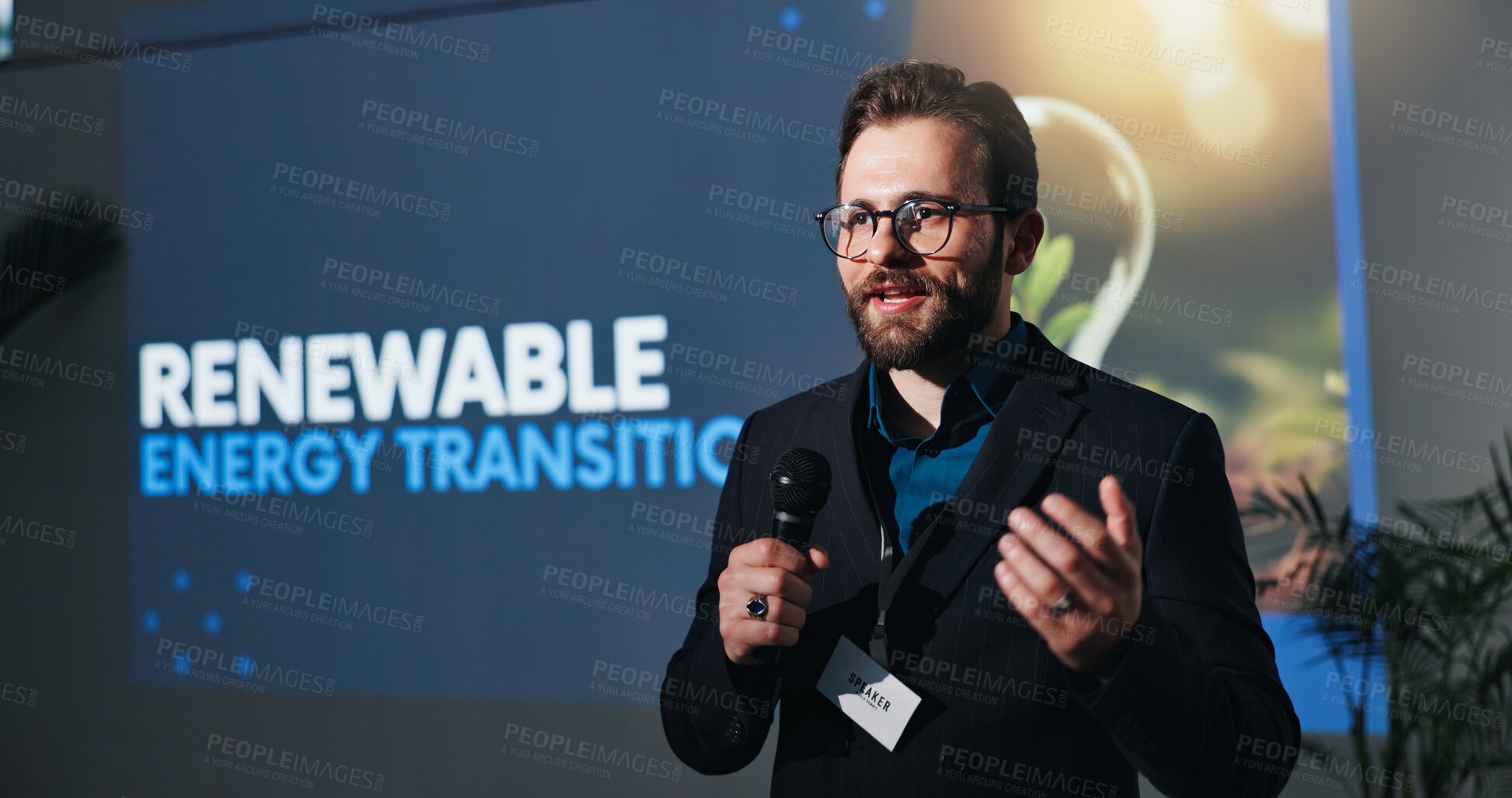 Buy stock photo Microphone, presentation and businessman on a stage at seminar for renewable energy transition. Public speaker, conference and male environmental manager at convention for sustainability company.