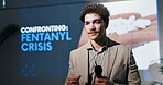 Forum, microphone and presentation with man in auditorium for speech on fentanyl crisis. Business, seminar and trade show with guest speaker on podium or stage for drug abuse or addiction solutions