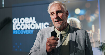 Buy stock photo Presentation, speaker and man with mic, speech and serious for global economic recovery and meeting. Stage, presenter and motivation for world investment, public speaking and mature person in seminar