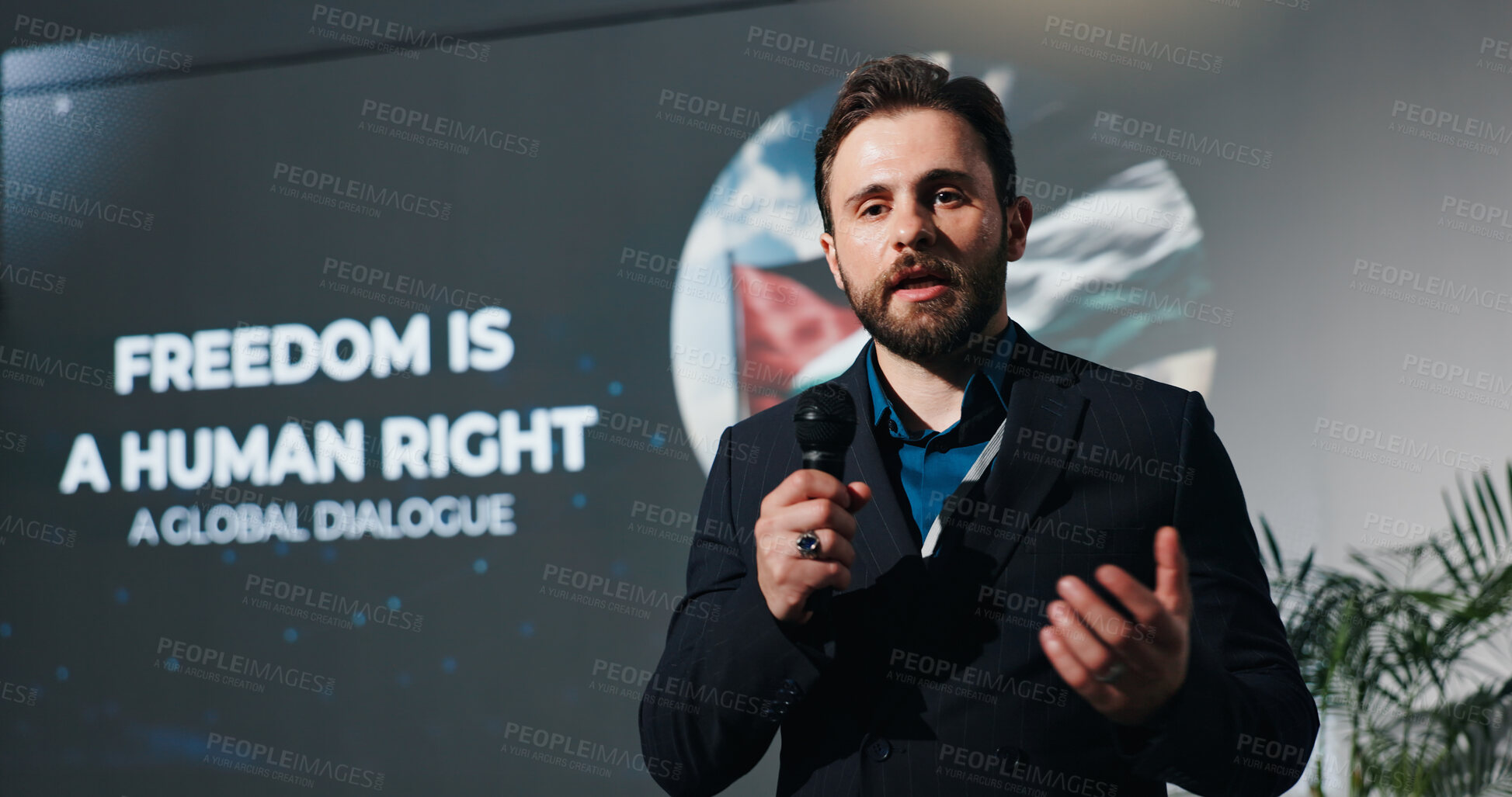 Buy stock photo Man, presentation and human rights at convention on stage for talk, freedom or info at event. Person, public speaking and discussion at global conference for equality, accountability or peace in Gaza