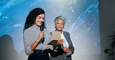 Buy stock photo Announcement, awards ceremony and presentation with business women on stage for corporate event. Microphone, prize giving and reading winner with employee people in auditorium or convention center