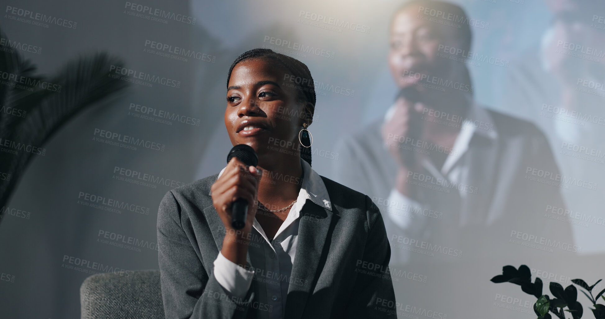 Buy stock photo Stage, presenter and woman with mic, talking and smile for public speaking in seminar or discussion. Happy, motivational speaker and black person with advice for entrepreneurship, speech and meeting