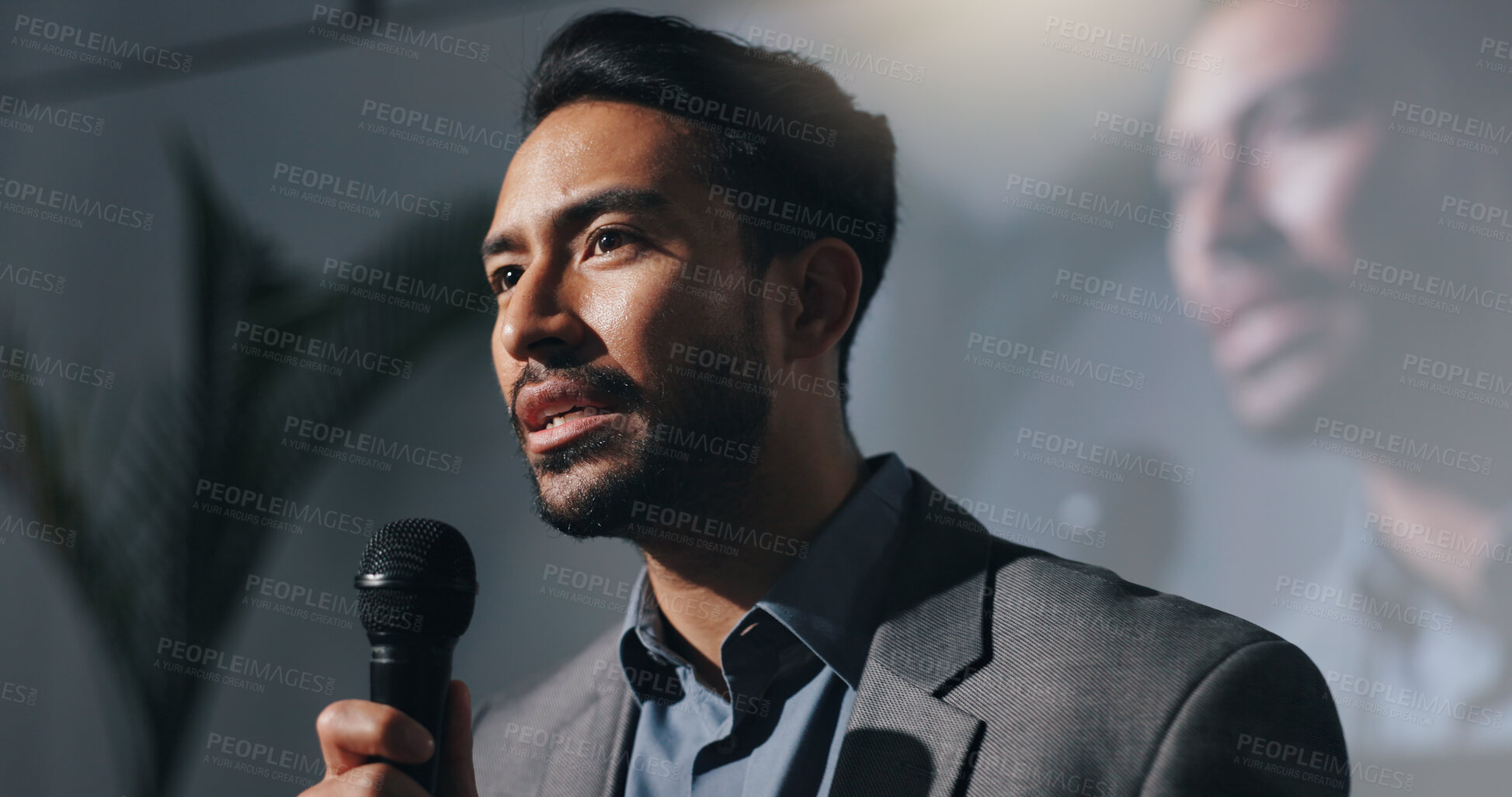 Buy stock photo Meeting, training and man with mic, speech or motivational speaker for session, serious and seminar. Stage, presenter and person with ideas for entrepreneurship, public speaking and presentation