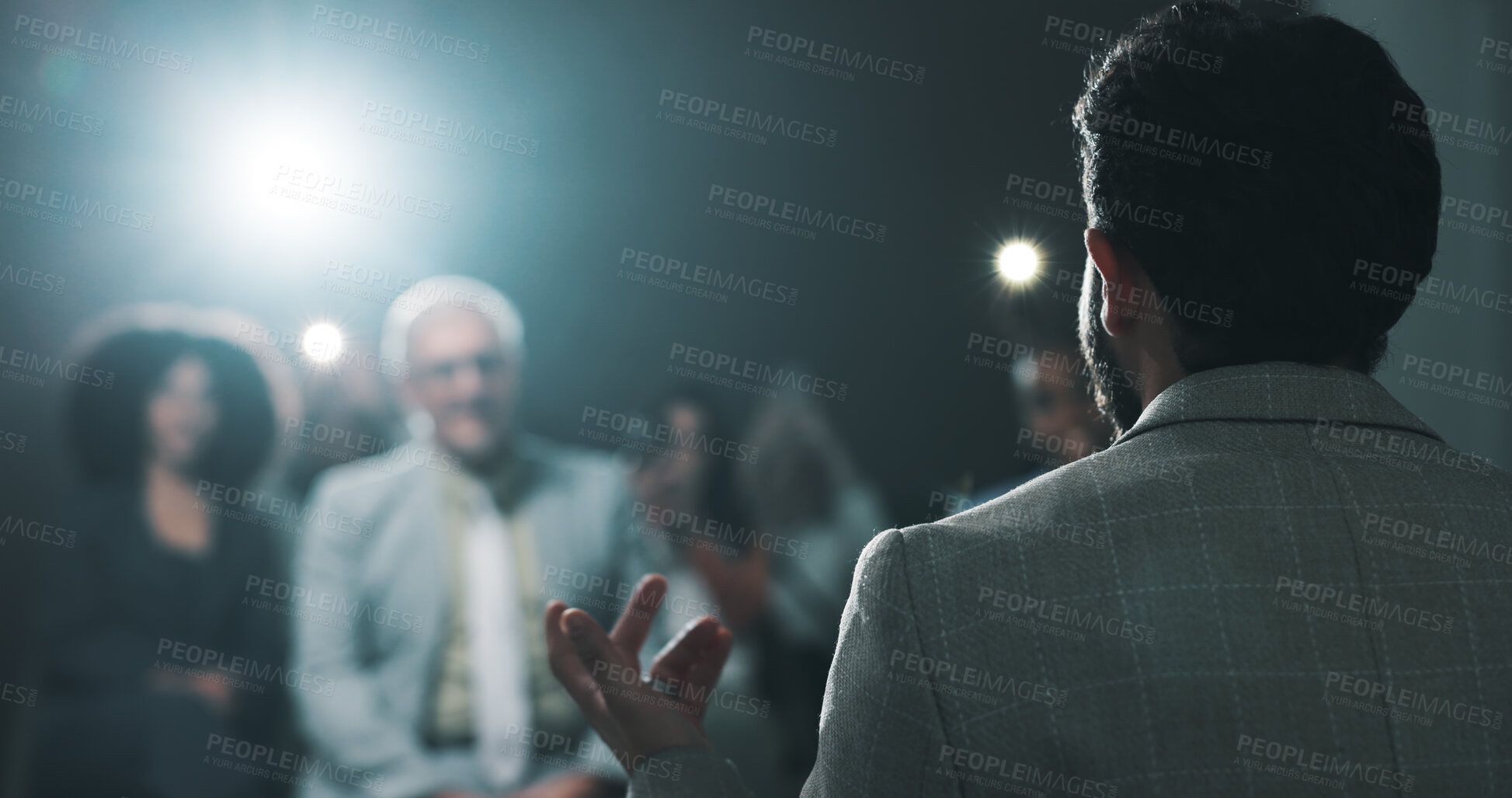 Buy stock photo Man, back of speaker or presentation for press conference, development seminar or business event. Audience, speech and workshop for economy talk in auditorium with flare, keynote and summit forum