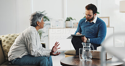 Buy stock photo Counseling, conversation and notes of therapist with patient in office for diagnosis or healing. Clipboard, mental health or therapy with counselor man and woman in session for consulting or support