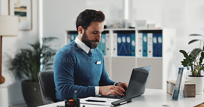 Buy stock photo Healthcare, laptop and typing with doctor in office for research or review of patient information. Computer, insurance and medical with man at desk in clinic for agenda, appointment or schedule