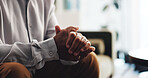 Hands, anxiety and person on sofa in counselling for mental health, help and psychology rehabilitation. Closeup, frustrated and diagnosis in therapy for fear, stress or overwhelmed with nervous worry