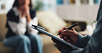 Writing, clipboard and counseling with hands of person for psychologist, mental health and evaluation. Therapy session, trauma rehabilitation and patient notes with therapist in clinic for assessment