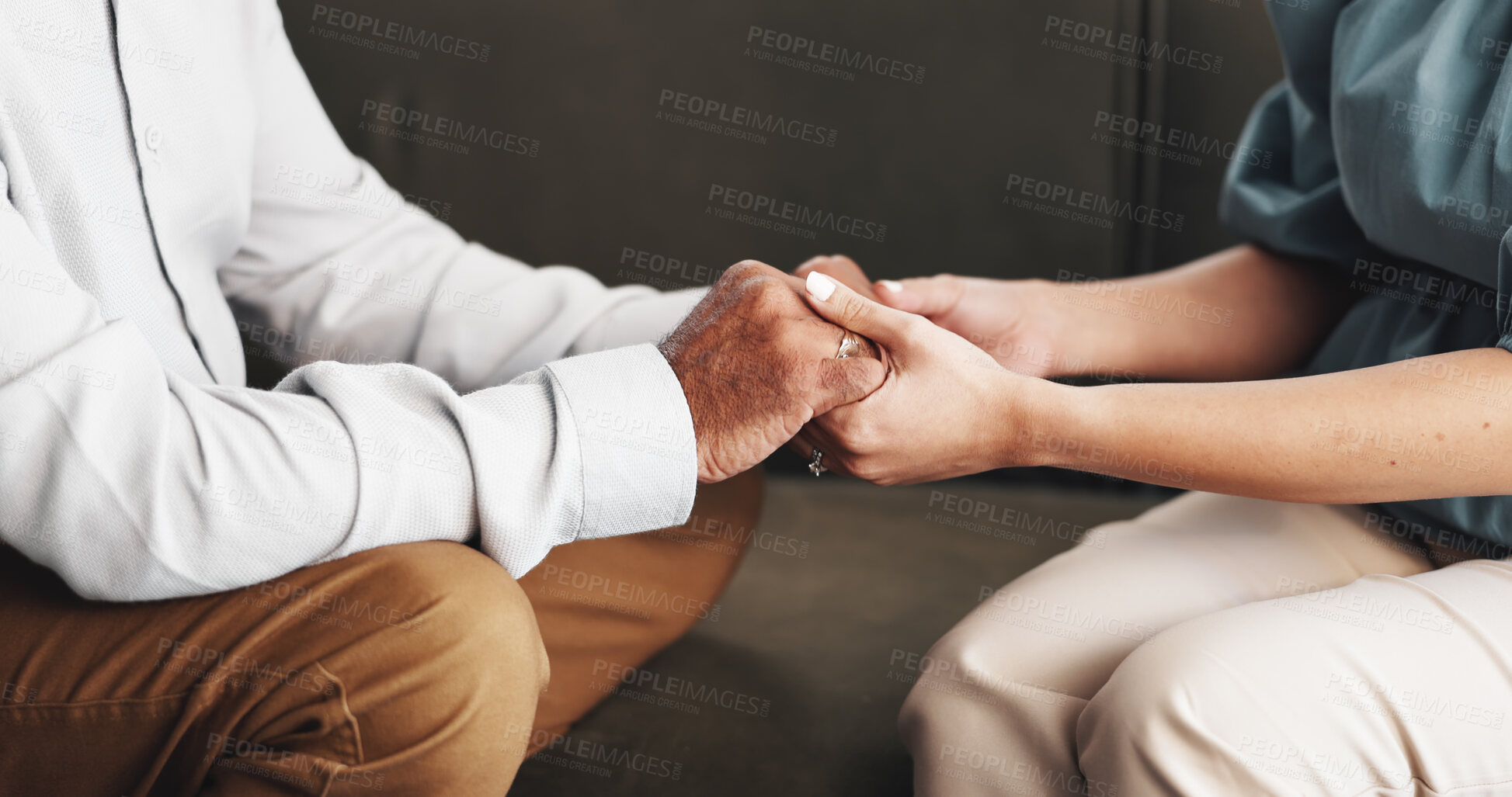 Buy stock photo Couple, therapy and holding hands for consultation, office and improving communication for marriage. Appointment, people and counselling for relationship, support and restoring trust in clinic