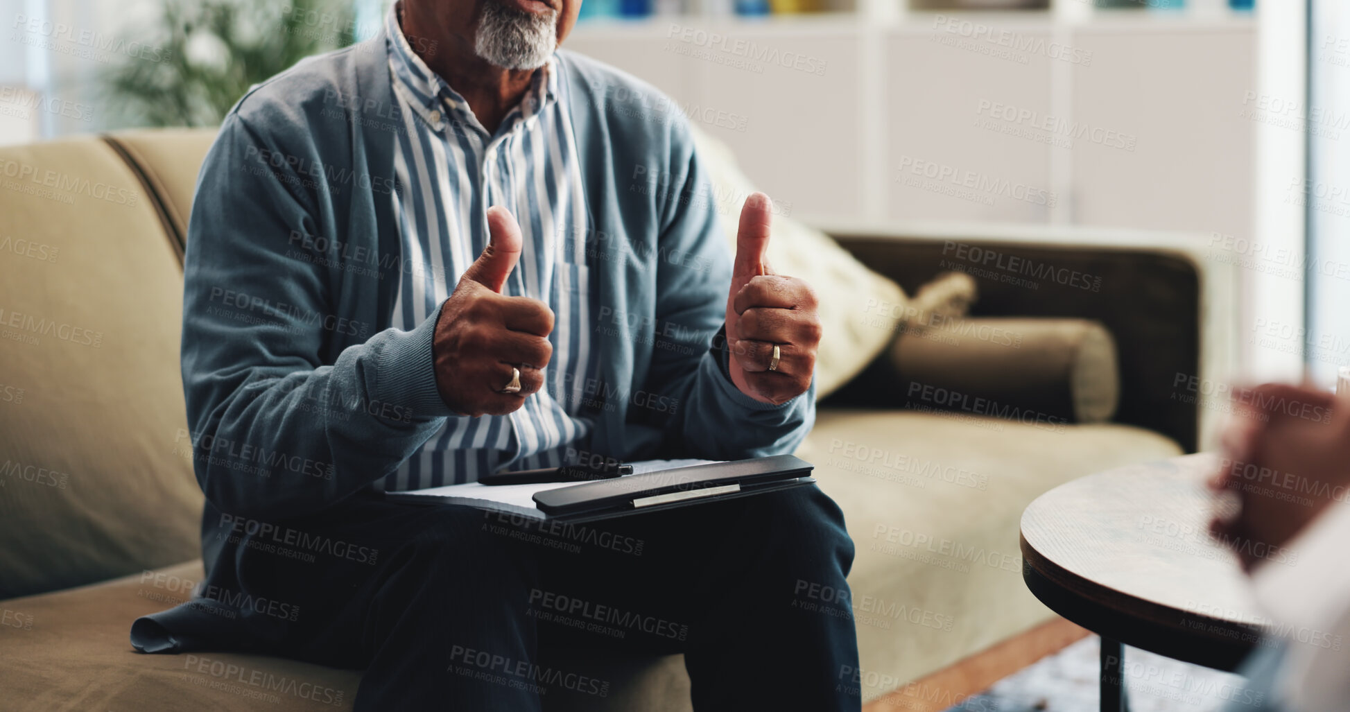 Buy stock photo Therapy, thumbs up and hands of psychologist on sofa for counseling success, assessment and support. Mental health, advice and progress with people in office for feedback and patient confidentiality