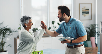 Buy stock photo Mature woman, physiotherapist and high five at clinic for recovery, goals and happy for good news. People, celebration and motivation with tablet for results, support and rehabilitation at hospital