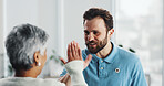 High five, healthcare and physical therapist with senior woman in clinic for rehabilitation healing. Celebration, good news and physiotherapist with elderly female person for recovery progress.
