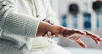Wrist pain, massage and injury with hands of old woman for fibromyalgia, joint accident and sprain. Emergency risk, orthopedic tension and osteoarthritis with closeup of senior person in clinic