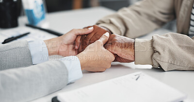 Buy stock photo Empathy, holding hands and healthcare with people in office together for comfort or understanding. Bad news, medical or trust with doctor and patient in hospital for conversation, healing or support